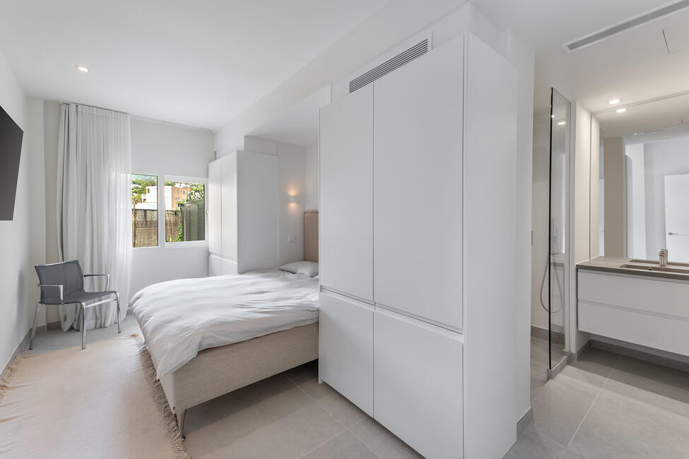 Luxuriously renovated garden apartment with communal pool in Portals Nous