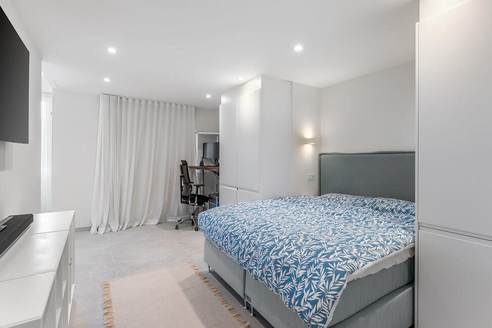 Luxuriously renovated garden apartment with communal pool in Portals Nous