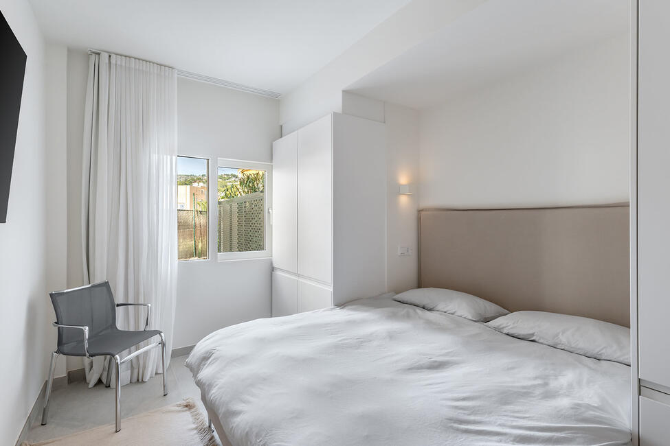 Luxuriously renovated garden apartment with communal pool in Portals Nous