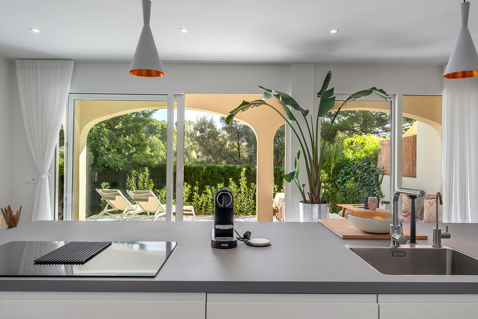 Luxuriously renovated garden apartment with communal pool in Portals Nous