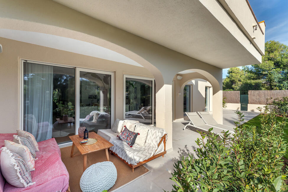 Luxuriously renovated garden apartment with communal pool in Portals Nous