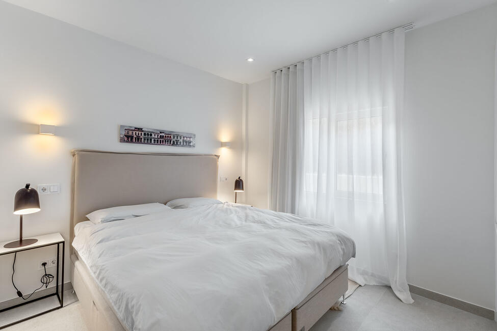 Luxuriously renovated garden apartment with communal pool in Portals Nous
