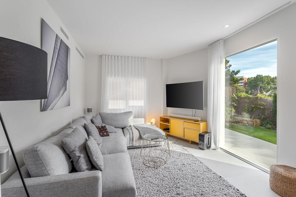 Luxuriously renovated garden apartment with communal pool in Portals Nous